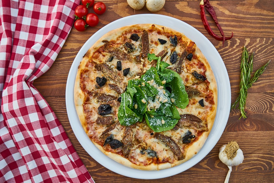 https://pixabay.com/en/pizza-meat-dough-greens-olives-2802332/